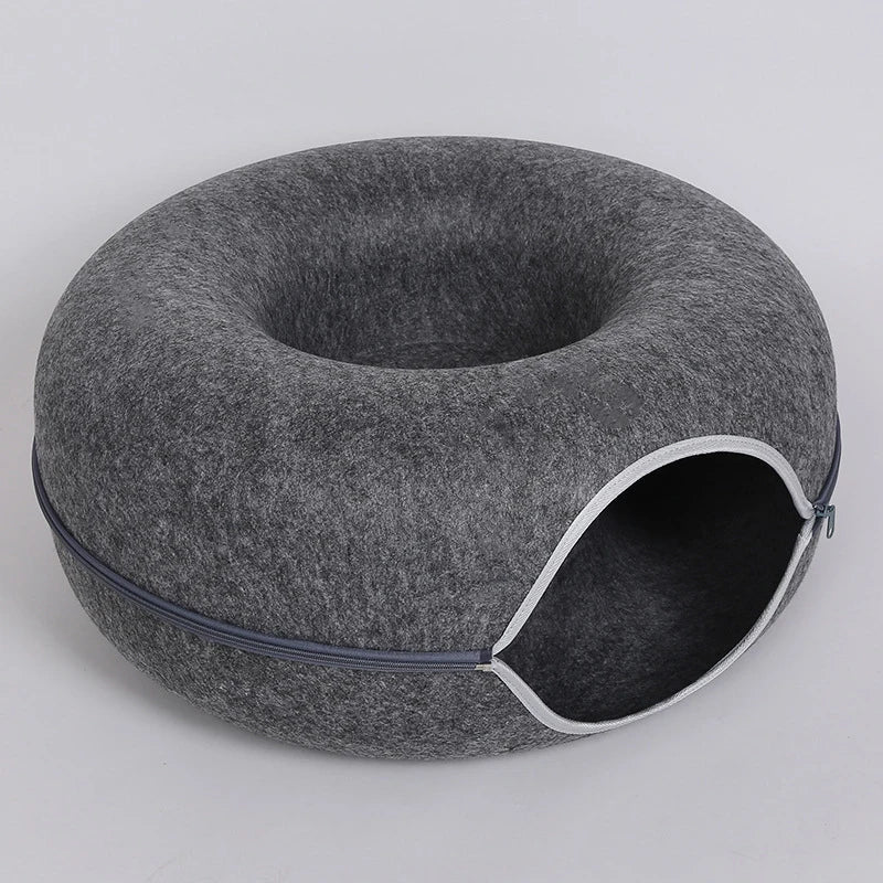 Dark gray zippered donut-shaped cat tunnel bed made of felt with an open entrance
