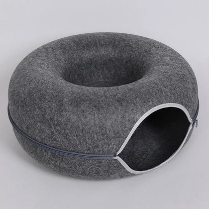 Dark gray zippered donut-shaped cat tunnel bed made of felt with an open entrance