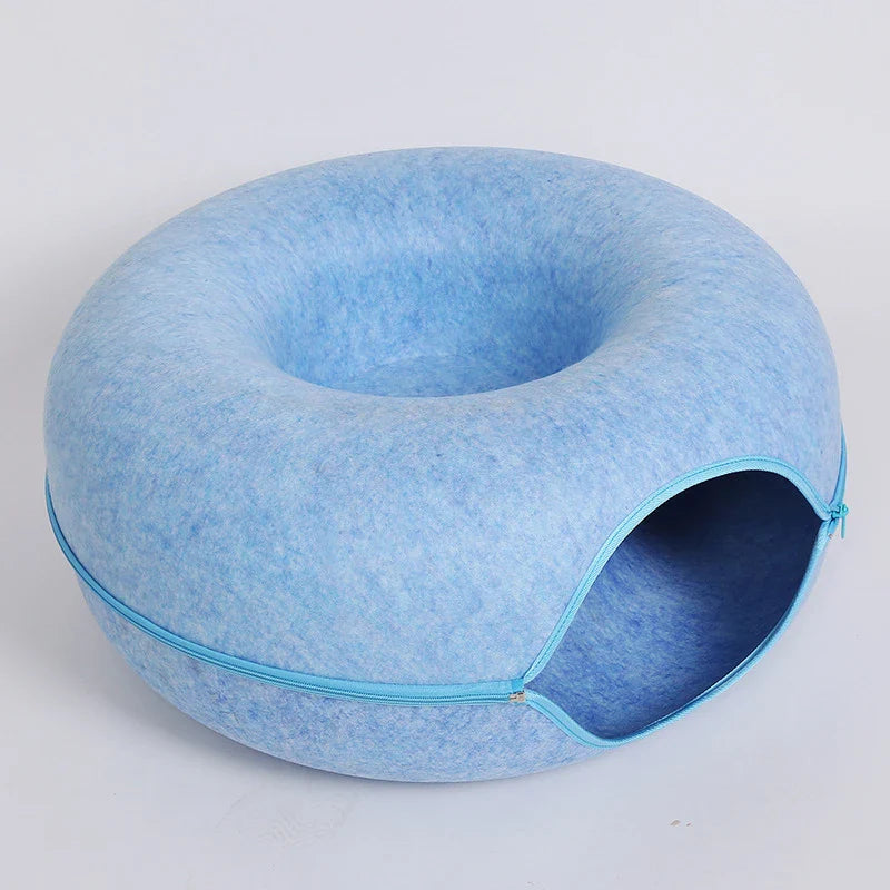 Blue zippered donut-shaped cat tunnel bed made of felt with an open entrance