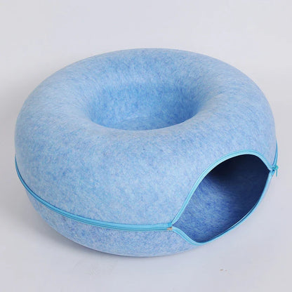 Blue zippered donut-shaped cat tunnel bed made of felt with an open entrance